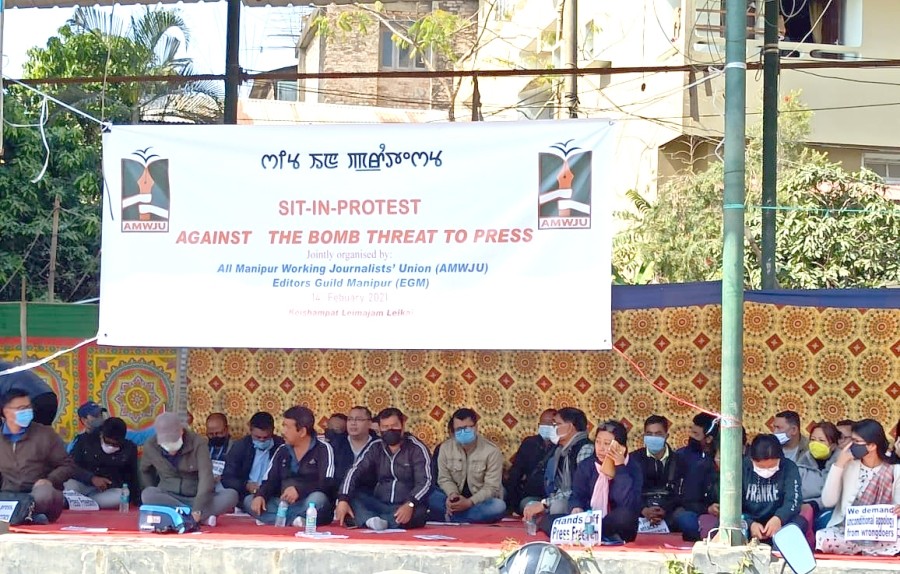 Scribes stage a sit-in protest in Imphal’s Keishampat on February 14 under the aegis of All Manipur Working Journalists’ Union and Editors’ Guild Manipur. (NNN Photo)